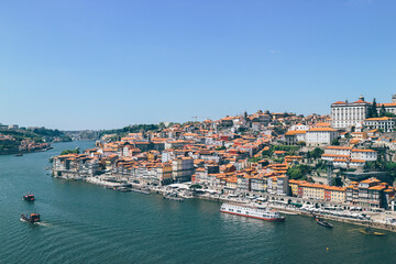Naklejka na ściany i meble View of Duoro bay of Oporto city from top with boats navigating 