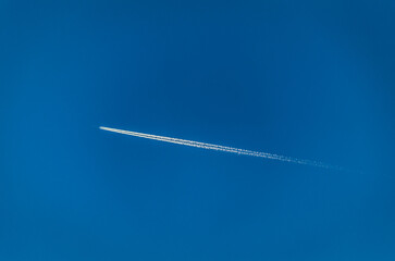 View of an airplane on blue sky background