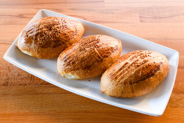 Turkish pastry product , tasty pogaca. Simit, gevrek. Turkish Pastries; peynirli, patatesli, kasarli pogaca, borek, acma, ay coregi at patisserie showcase.