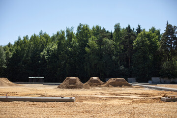 Construction of parking. Lots of sand. Material for foundation mound.