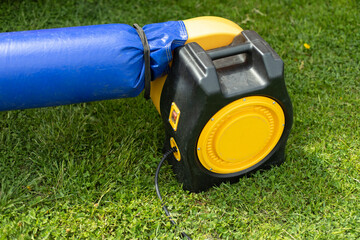 Electric trampoline pump. Air generator. Turbine on rubber casing.