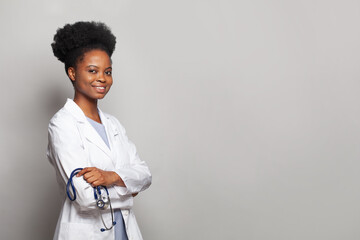 Confident female doctor medical professional smiling on white background