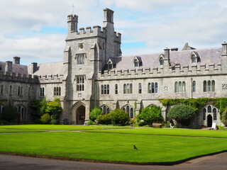 Fototapeta na wymiar UCC University College Cork in Ireland- main building with batllements and ivy
