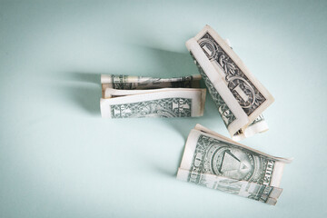 dollar bills on a wooden table