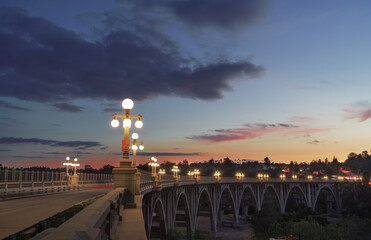 The iconic Colorado Street Bridge in Pasadena shown at dusk.