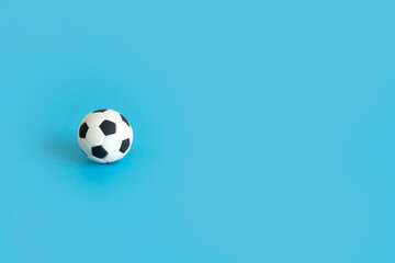 Fototapeta na wymiar soccer ball on blue background , classic football