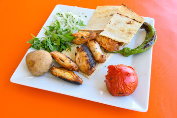 Chicken wings barbeque in a dish with BBQ grill sauce . Izgara tavuk kelebek sis kanat. Tavuk sis, gogus.