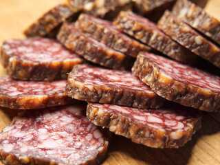 Dried sausage, macrophoto. Lots of sausage slices.