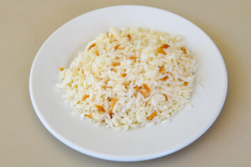 Traditional delicious Turkish food; Turkish style rice pilaf (Turkish name; Arpa sehriyeli. tavuklu, kuru fasulyeli, kavurmali pirinc pilavi)