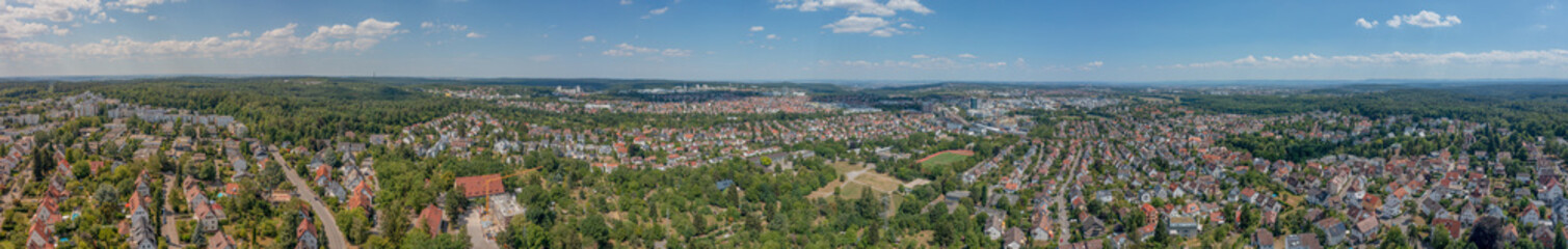 Fototapeta na wymiar Extra wide panorama of Stuttgart Vaihingen, Rohr, Dürlewang and Möhringen, Germany, Wide view over houses, roofs, churches and buildings on a sunny summer day