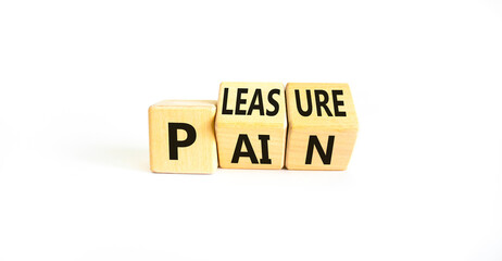 Pain or pleasure symbol. Concept words Pain or Pleasure on wooden cubes. Beautiful white table white background. Business and pain or pleasure concept. Copy space. - obrazy, fototapety, plakaty