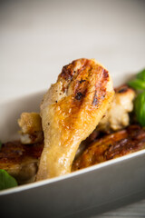 grilled chicken legs fried with spices and herbs