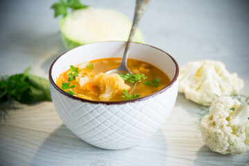 vegetable summer soup with cauliflower in a bowl