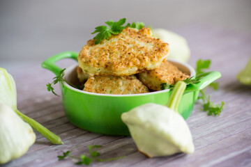 vegetable fried squash and zucchini cutlets in a ceramic form