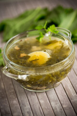 Spring soup from fresh sorrel with boiled eggs in a plate