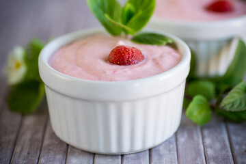 sweet curd mass whipped with fresh strawberries in a bowl