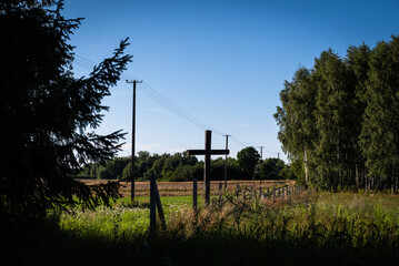 Two crosses in Podlasie with the countryside in the background