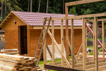 Fototapeta na wymiar construction of a frame house. Timber frame house, new build roof 