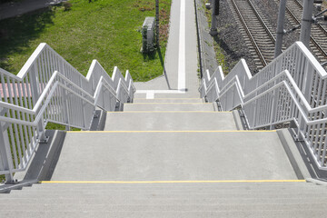 Stairway to footbridge or overpass divided into two sides for walking up and down, Stainless steel...