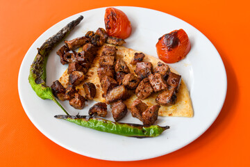 Chicken wings barbeque in a dish with BBQ grill sauce . Izgara tavuk kelebek sis kanat. Tavuk sis, gogus.