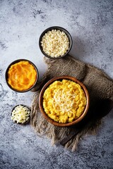 Millet porridge with pumpkin puree and cheese in a bowl