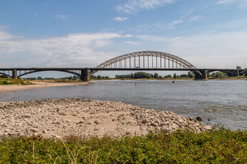 Very low water level in the river Waal at the Waal bridge (Waalbrug) in Nijmegen.