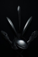 Premium spoon and ladle on black background