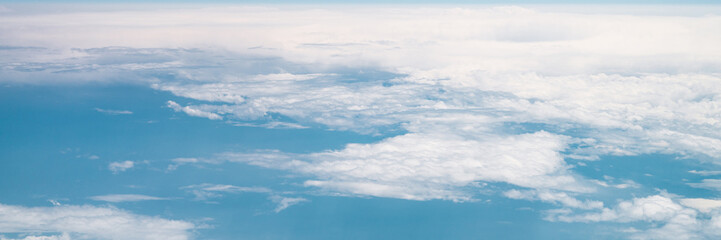 Fototapeta premium beautiful blue sky with white clouds heaven horizon over planet earth world, view from the airplane or satellite. atmosphere or stratosphere space layer. astronomy and geology sciense nature. banner