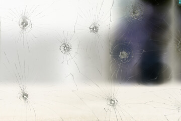 group of bullet holes on the glass abstract background window