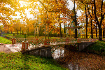 Chinese bridge in autumn foliage in Alexander park, Pushkin (Tsarskoe Selo), Saint Petersburg,...