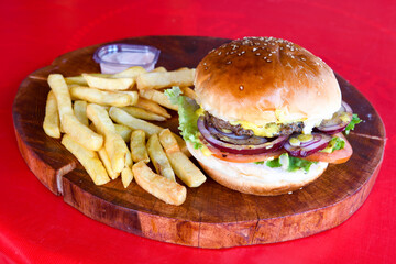 Big tasty burger with beef cutlet on a plate. Crispy chicken burger.