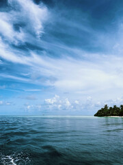 Fototapeta na wymiar View on an ocean and a tropical island