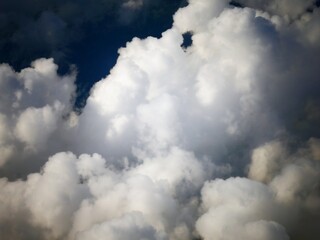 Thick fluffy, white clouds in the skies