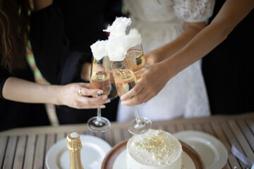 Girls hold glasses of wine. Party details. Wedding celebration.