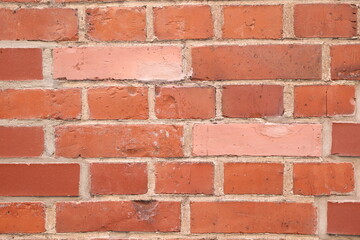 Brick wall with two bricks of different color pattern background of orange stones bricks