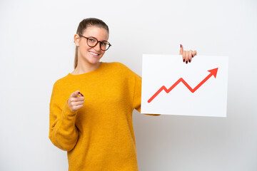 Fototapeta na wymiar Young caucasian woman isolated on white background holding a sign with a growing statistics arrow symbol and pointing to the front
