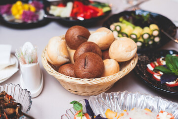 Catering table, beautifully decorated banquet with variety selection of different food snacks and appetizers on a corporate birthday party event or wedding celebration, delicatessen setting