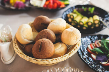 Catering table, beautifully decorated banquet with variety selection of different food snacks and appetizers on a corporate birthday party event or wedding celebration, delicatessen setting