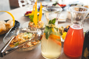 Catering table, beautifully decorated banquet with variety selection of different food snacks and appetizers on a corporate birthday party event or wedding celebration, delicatessen setting