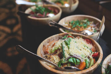 Catering table, beautifully decorated banquet with variety selection of different food snacks and appetizers on a corporate birthday party event or wedding celebration, delicatessen setting