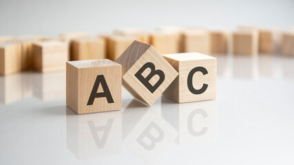 ABC - Always Be Closing - shot form on wooden block