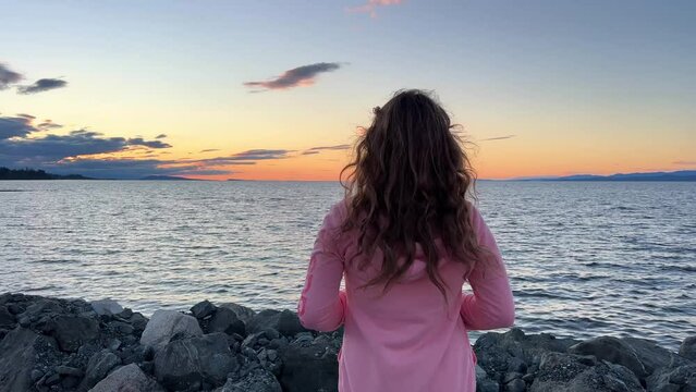 sunset on Ocean Horizon mountains are far visible many clouds and bright colors slow motion video suitable for music relaxation background For text silence peace Parksville beach Surfside RV resort