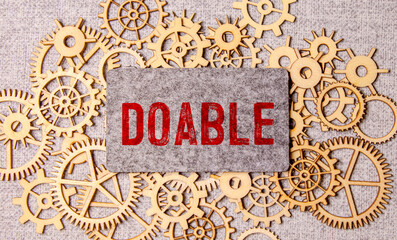 doable colorful word on the wooden background.