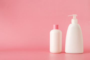 Cosmetics, Moisturizer, Bottle. Different cosmetic bottles. set of cosmetic products on pink background. Cosmetic package collection for cream, soups, foams, shampoo.