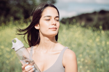 Girl WIth Water Bottle Enjoying the Sun