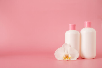 Cosmetics, Moisturizer, Bottle. Different cosmetic bottles. set of cosmetic products on pink background. Cosmetic package collection for cream, soups, foams, shampoo.