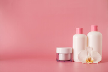 Fototapeta na wymiar Cosmetics, Moisturizer, Bottle. Different cosmetic bottles. set of cosmetic products on pink background. Cosmetic package collection for cream, soups, foams, shampoo.
