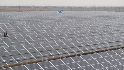 Timelapse of process of solar panel power station assembling in field. Equipment to produce clean energy. Electrical station and renewable sources