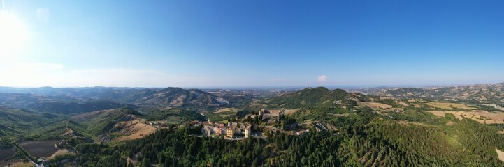 Fototapeta na wymiar aerial view of Montebello village and his castle also named Azzurrina castle. Poggio Torriana, Emilia Romagna, Italy