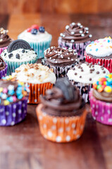 Colorful chocolate cupcakes with toppings